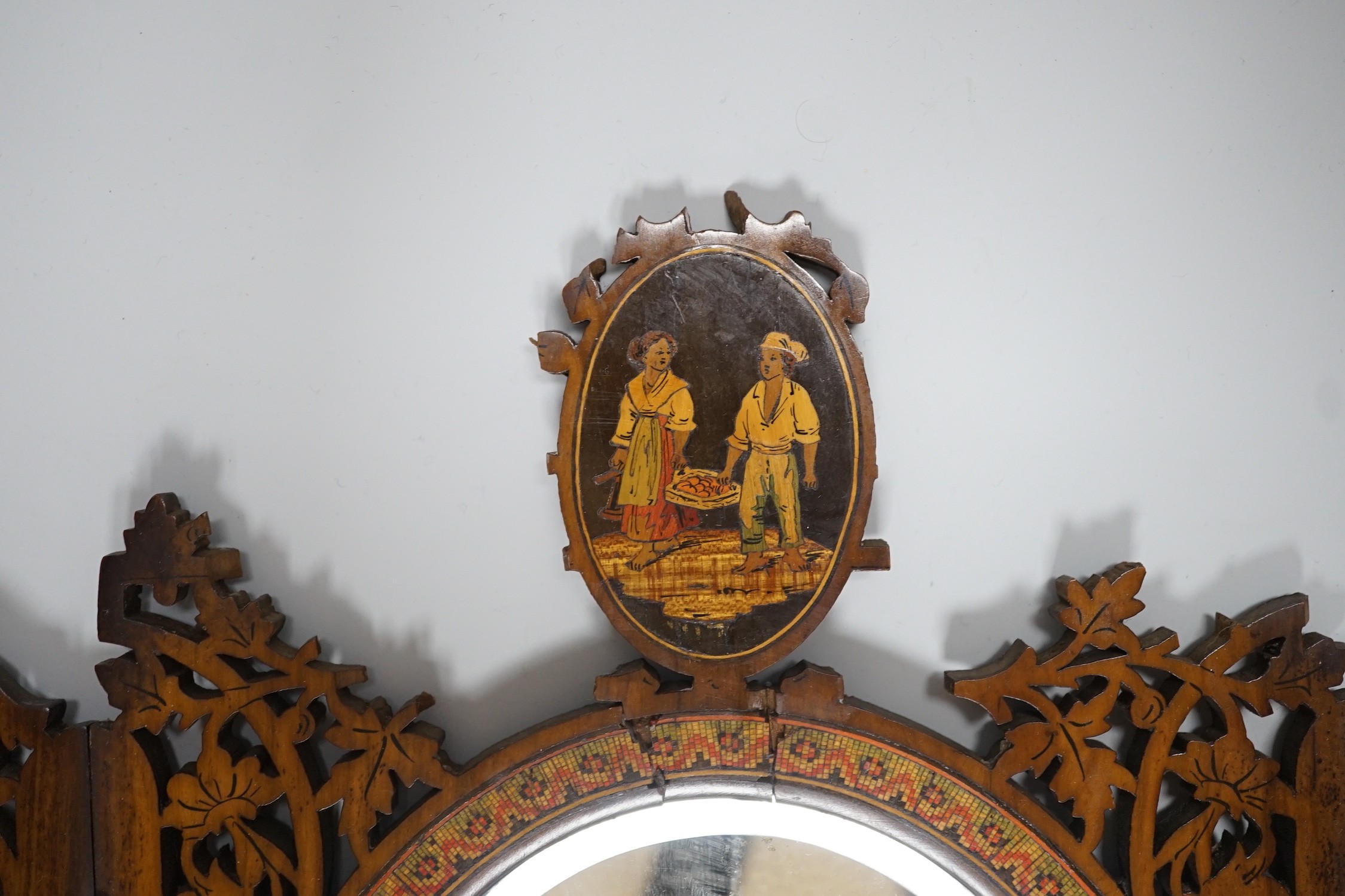A 19th century fretted olivewood Sorrento ware toilet mirror, 45cm long